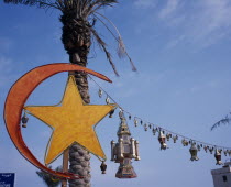 Gulf Road.  Crescent moon and lantern decorations for Eid at the end of Ramadan.Moslem Muslim