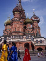 St Basil s Cathedral exterior with women in brightly coloured saris in the foreground.Eastern Europe Colored