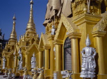 Shwedagon Paya.  Golden shrines and statues in temple complex.Pagoda Burma Rangoon Shwe Dagon Myanmar Yangon