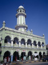 Pale green and white painted exterior of mosque on Lashio Road with central minaret.Pyin-U-Lwin Burma Moslem Muslim Myanmar