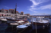 Bol  boats in marina. The marina in the small village isolated on the islands southern coast is filled with fishing boats aswell as schooners and yachts southern Croatiasailing
