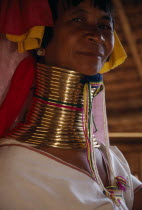 Head and shoulders portrait of Paduang  long neck  woman with neck elongated by lengths of coiled brass.Kayan TribeKarenni