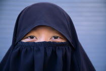 Head and shoulders portrait of Muslim girl wearing a NiqabMoslem