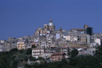 Piazza Armerina. Hilltop town buildings with a church dome at the top