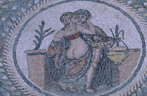 Piazza Armerina. Villa Romana del Casale. Detail of  a Roman Mosaic with a male and female figure encircled