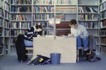 Oxford Library interior with students studying at desks surrounded by bookcases
