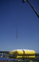 Giant crane with jumper suspended over large inflatable  Rapid City  South Dakota.