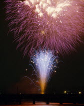 Hanabi fireworks display on a jetty over water
