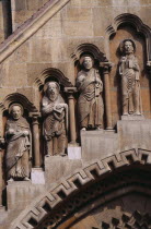 Benedictine Abbey of Jak. Detail of carved religious figures over stone archway.