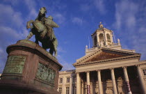 Royal Square.  Exterior facade of Church of Saint James with equestrian statue of Godfrey of Bouillon leader of the first crusade in 1096 in foreground.