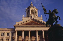 Royal Square.  Exterior facade of Church of Saint James with equestrian statue of Godfrey of Bouillon leader of the first crusade in 1096 in foreground.