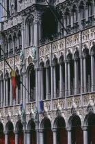 Grand Place.  Maison du Roi.  Part view of exterior with carved  colonnade and statues.