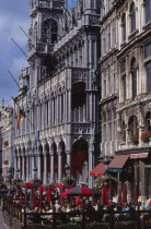 Grand Place.  Maison du Roi.  Angled view of exterior with busy outside cafe in the foreground.