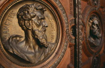 Basilica of St Stephen.  Detail of door with bronze relief carvings of the heads of the twelve apostles.Eastern Europe  Eastern Europe