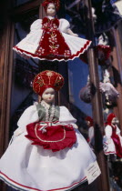 Handmade dolls in National costume for sale displayed outside shop window.Eastern Europe Store Eastern Europe Store
