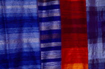 Detail of red and blue woven textiles.