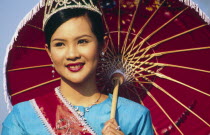 Bo Sang Umbrella fair. Thai girl with tiara and umbrella The village of Bo Sang is world famous for its hand made and painted umbrellas. Each January they celebrate with a colourful fair involving pro...