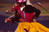 Aymara dancer dressed in her traditional costume  an Aymara girl performs a folk dance on the shore of Lake TiticacaIndigenous people