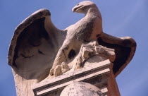 Archeological museum/sculpture of Roman eagle. Flanking the main building of the museum are two giant pillars. Perched majestically atop the left hand column is a magnificent sculpture of a Roman eagl...