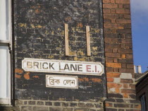 Whitechapel  Brick Lane bi-lingual street sign in English and Arabic. East EndUnited Kingdom Great Britain UK