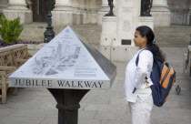 Tourist consulting map outside the Bank of England in  Threadneedle Street.United Kingdom Great Britain UK