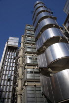 Lloyds of London building polished metal exterior with elevators on the outside. Deigned by Architect Sir Norman Foster.United Kingdom Great Britain UK