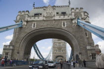 Traffice and pedestirans crossing Tower BridgeUnited Kingdom Great Britain UK