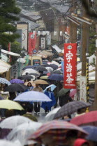 Rainy day in crowded Eastern Kyoto lane near Ginkaku-ji TempleAsia UrbanWeatherPeople