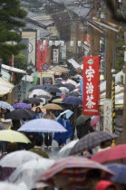 Rainy day in crowded Eastern Kyoto lane near Ginkaku-ji TempleAsia UrbanWeatherPeople