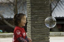 Child playing with bubbles near Maruyama-koen ParkAsia Children