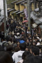Crowded lane in Sannen-zaka - wooden houses shops teahouses and touristsAsia UrbanPeople