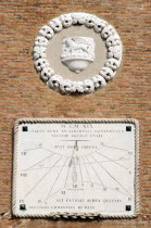 A sundial on the wall of the Arsenal with year in Roman numerals and words in Latin. The crest of Venice  the winged Lion of Saint Mark  sits above.
