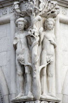 A stone carving of Adam and Eve with the Serpent in the tree on the corner of the Doges Palace by the Piazzetta