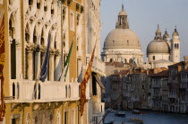 The Baroque church of Santa Maria della Salute on the Grand Canal. The Palazzo Franchetti Cavalli of Archduke Frederick of Austria on the left is decked with flags