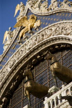 The bronze Horses of St Mark and the winged Lion of St Mark below Angels on the facade of St Marks Basilica
