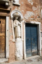 A stone figure of a Moor beside Tintorettos house on Fondamenta dei Mori in the Cannaregio district