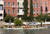 Local schoolchildren rowing a dragon boat on the Grand Canal