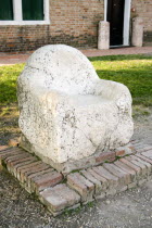 A marble seat said to be used as a throne by the 5th Century king Attila on the deserted lagoon island of Torcello