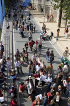 Paris The Paris Plage urban beach. A singer playing a piano to an audience under the Pont Notre Dame on the Voie Georges Pompidou a usually busy road closed to traffic