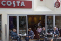People sat outside the Costa coffee shop in Bond street in the North Laines area.Great Britain Store United Kingdom