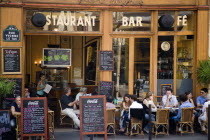 Montmartre People sitting at pavement tables outside a cafe on Rue Yvonne le TacBar Bistro European French Restaurant Western Europe