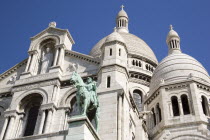 Montmartre The Church of Sacre Coeur or Sacred Heart with the bronze equestrian statue of Joan of Arc in the foregroundEuropean French Religion Western Europe