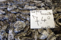 Squid in their ink for sale in the Pescheria fish market in the San polo and Santa Croce district beside the Rialto Bridge on the Grand Canal