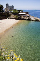 The Basque seaside resort on the Atlantic coast. The Plage de Port-Vieux with a seafood restaurant on a promontory at the end of the beach