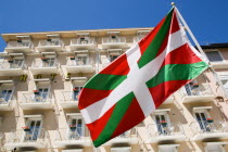 The Basque seaside resort on the Atlantic coast. Basque flag flying in front of hotel balconies