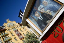 The 1906 Art Nouveau Hotel Europa in Wenceslas Square with a painting on an old tram outside a cafe in the foreground