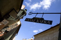 Hanging sign for the Franz Kafka Cafe in Golden Lane within Prague Castle.