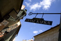 Hanging sign for the Franz Kafka Cafe in Golden Lane within Prague Castle.