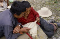 Reading Tibetan prayer book.