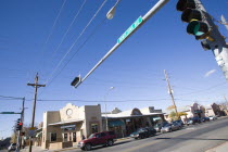 Cars stopped at overhead raffic lights at the junction with Montezuma Avenue